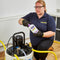 A Person using Fernox F8 in a power flushing machine